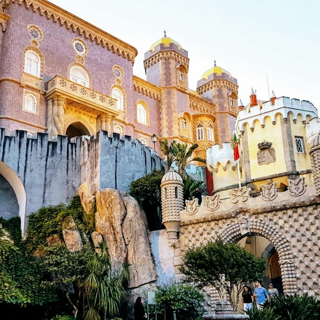 Discover the colorful architecture of Pena Palace, a historic landmark in Sintra, Portugal.